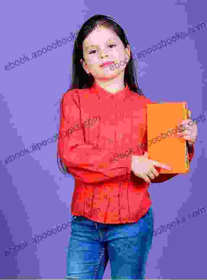 A Young Woman Holds A Book With A Red Cover. The Title Of The Book Is Hillbilly Elegy: A Memoir Of A Family And Culture In Crisis