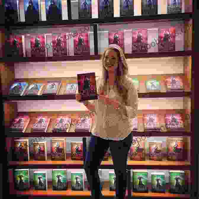 Author Delorah Grace Posing With Her Books. Veiled Enemy (Hidden Keys 8) (Hidden Keys Legacy)