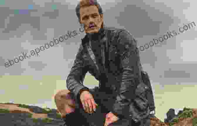 Sam Heughan Standing In A Field In Scotland Waypoints Sam Heughan